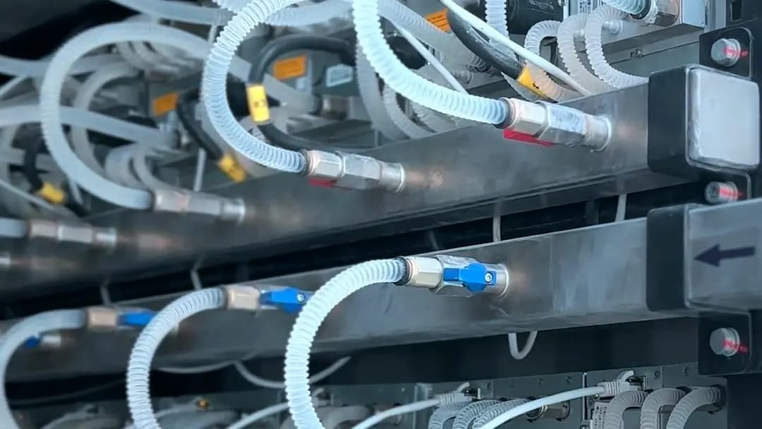 Water-cooling hoses on a rack of hydro-cooled miners